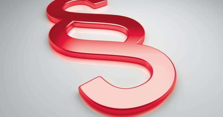 Rotes Paragraphenzeichen, das für das Gebäudeenergiegesetz GEG steht