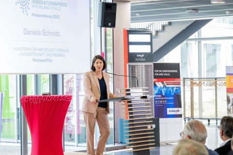Woman gives speech at award ceremony.