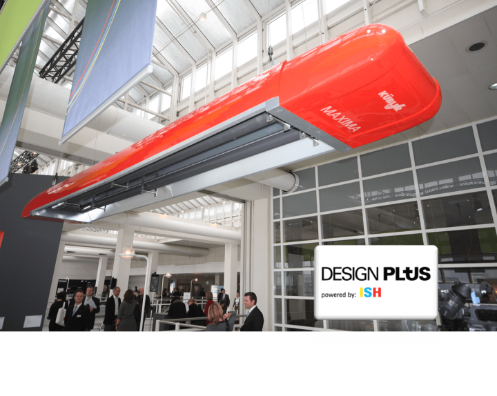 People under red hanging airplane at trade fair.