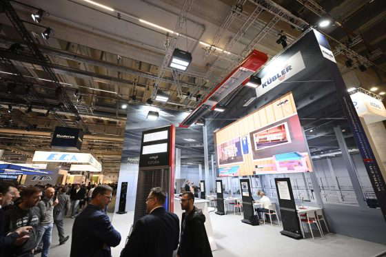 Visitors at a trade fair with company stands