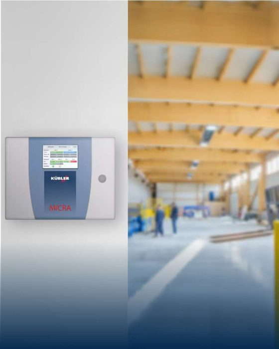 Digitaalinen laite sumeassa tehdashallissa