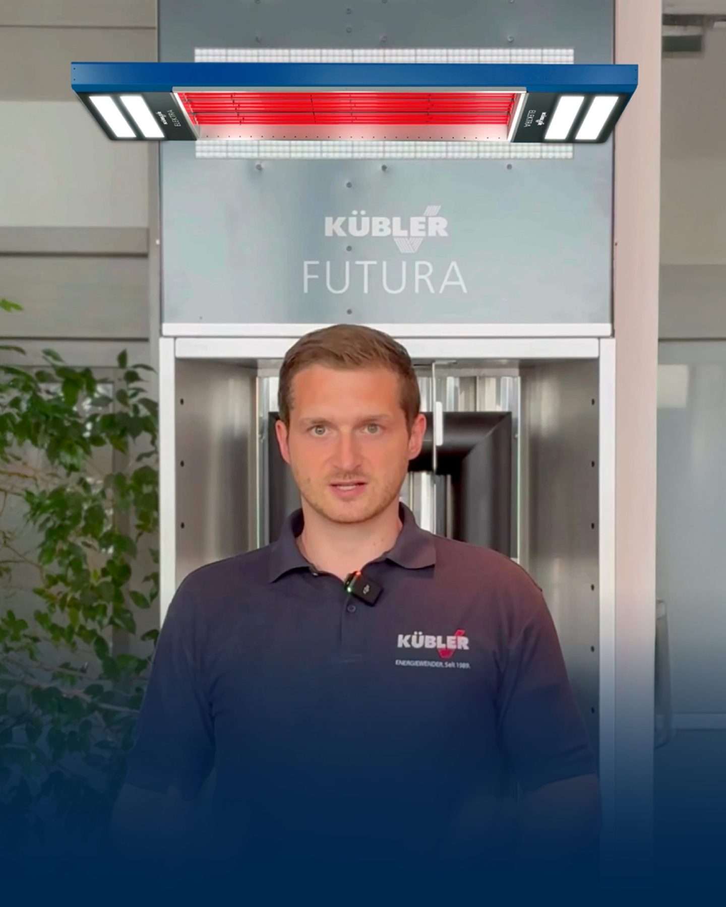 Mann präsentiert Kübler FUTURA Heizsystem